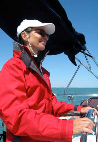 Anita at the helm of her sailboat testimonial Anita at the helm of her sailboat testimonial