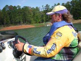 Linda fishing on lake in her bass boat testimonial